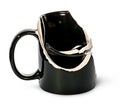 Broken black ceramic cup fragments are inside Royalty Free Stock Photo