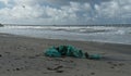 Broken blue fish net on sand Ocean Beach Pier and Dog Beach Royalty Free Stock Photo