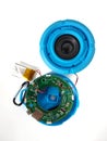 Broken bluetooth speaker with lithium battery is ready to service, isolated with white background. This blue loudspeaker with a li