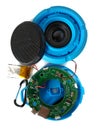 Broken bluetooth speaker with lithium battery is ready to service, isolated with white background. This blue loudspeaker with a li