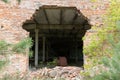 Broken brick wall. A carved passage in the wall