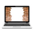 Broken brick wall on laptop screen Royalty Free Stock Photo