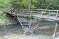 Broken bridge over a small stream Royalty Free Stock Photo