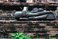 A broken Buddha statue.