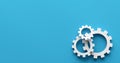 Broken business process or workflow failure concept. Cogwheels or gears on each other on blue background