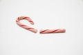 Broken candy cane on a white background