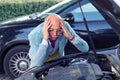 Stressed man having trouble with broken car Royalty Free Stock Photo