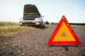 Broken car concept, breakdown triangle on road Royalty Free Stock Photo