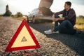 Broken car concept, breakdown triangle on road Royalty Free Stock Photo