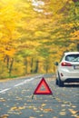 Broken car concept, breakdown triangle on road Royalty Free Stock Photo