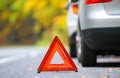 Broken car concept, breakdown triangle on road Royalty Free Stock Photo