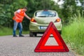 Broken car on the road and unhappy driver Royalty Free Stock Photo