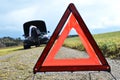 Broken car and triangle Royalty Free Stock Photo