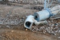 Broken CCTV camera laying on the ground. Concept of surveillance is not protecting people