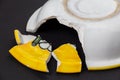Broken ceramic yellow plate Royalty Free Stock Photo