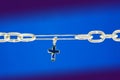 Broken chain connected with a cross Royalty Free Stock Photo