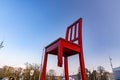 Broken Chair is a monumental sculpture in wood designed by Swiss artist Daniel Berset, Geneva, Switzerland
