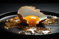 A broken chicken egg displayed on a somber black plate, raw vulnerability Royalty Free Stock Photo