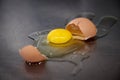 Broken chicken egg on the iron table close-up. horizontal view. a raw egg Royalty Free Stock Photo