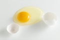 Broken chicken egg on a white background whit shell Royalty Free Stock Photo