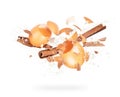 Broken chicken eggs and cinnamon sticks with splashes of flour, isolated on white background Royalty Free Stock Photo