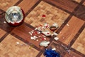 Broken christmas decoration and shards lie on the floor Royalty Free Stock Photo