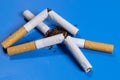 broken cigarettes with scattered tobacco, quit smoking concept Royalty Free Stock Photo