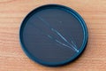 Broken circular polarizing filter. Damaged CPL filter. Royalty Free Stock Photo