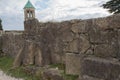 The broken city walls of the ancient Georgian city. Ancient inscriptions carved in the stone
