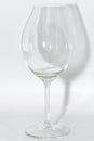 Broken clear wineglass with sharp glass fragments Royalty Free Stock Photo