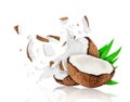 Broken coconut into two pieces with milk splashes