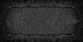 Broken concrete wall. Black rough cement texture. Dark gray frame background Royalty Free Stock Photo