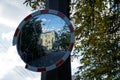 Broken convex mirror with cracked - view from a street mirror to a street