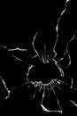 broken cracked glass with big hole over black background Royalty Free Stock Photo