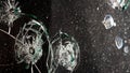 broken cracked glass with hole over black background Royalty Free Stock Photo