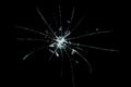 Broken cracked glass with hole over black background Royalty Free Stock Photo