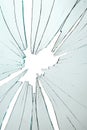 Broken and cracked glass with hole on a white background Royalty Free Stock Photo