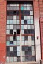 Broken and cracked industrial windows in metal frames Royalty Free Stock Photo