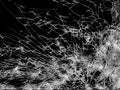 Broken cracks glass fracture effect texture isolated abstract black background. cracked pnone screen with big hole shot Royalty Free Stock Photo