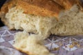 Broken crust of fresh fragrant bread close-up