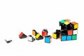 Broken a cube of Rubiks and a part from it. Royalty Free Stock Photo