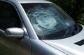 Broken damaged car windshield glass window. Royalty Free Stock Photo