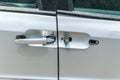 Broken and damaged door handle on the silver car close up