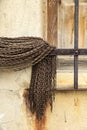 Broken and damaged window with metal curtain in an old house Royalty Free Stock Photo