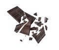 Broken dark chocolate bar with flying pieces in the air on white background Royalty Free Stock Photo