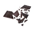 Broken dark chocolate bar with pieces flying in the air on a white background Royalty Free Stock Photo