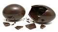 Broken dark chocolate Easter egg on white background Royalty Free Stock Photo