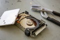 Broken and Destroyed Hard Drive Disk on Wooden Table Royalty Free Stock Photo