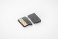 Broken destroyed micro sd card on white surface Royalty Free Stock Photo