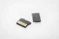 Broken destroyed micro sd card on white surface Royalty Free Stock Photo